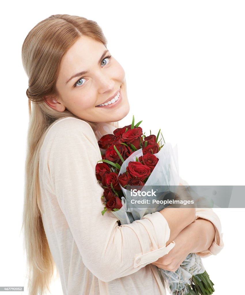 Just for me Studio shot of a beautiful young woman holding a bouquet of red roses against a white backgroundhttp://195.154.178.81/DATA/istock_collage/0/shoots/782470.jpg 2015 Stock Photo