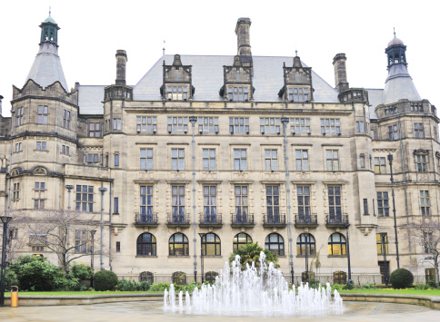 **Stitched image** Sheffield Town Hall, UK, a 19th century building with early 20th century additions. Set in the Peace Gardens with fountains.
