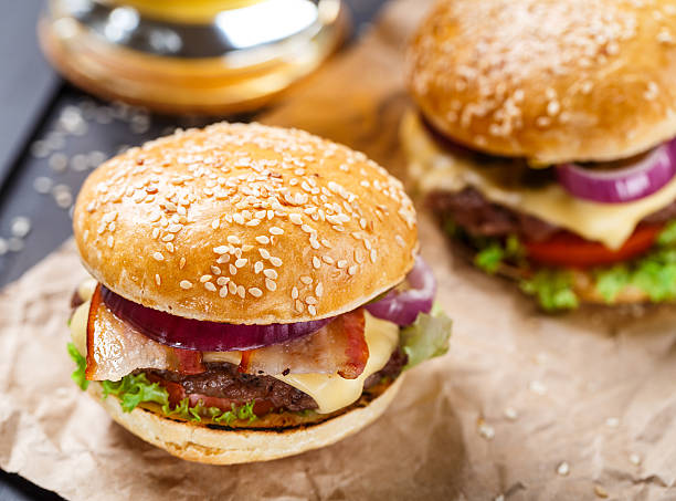 istock Delicious burger on wooden board 467793350
