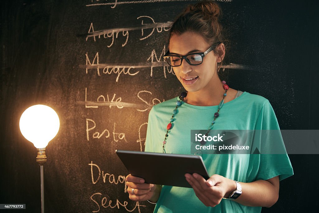 Doing business the modern way Shot of a woman standing in front of a blackboard while holding her digital tablethttp://195.154.178.81/DATA/istock_collage/a5/shoots/785348.jpg 2015 Stock Photo