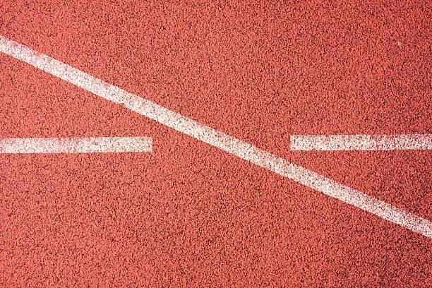 istock White lines and texture of running racetrack, red rubber racetracks 467794510