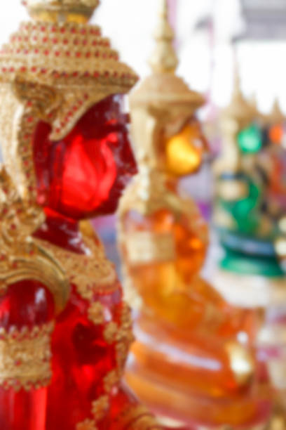 istock blurry defocused image of red buddha statue for background 467795516
