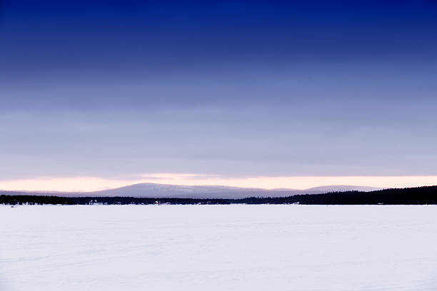 Finnish sunset near a frozen lake, near the arctic circle