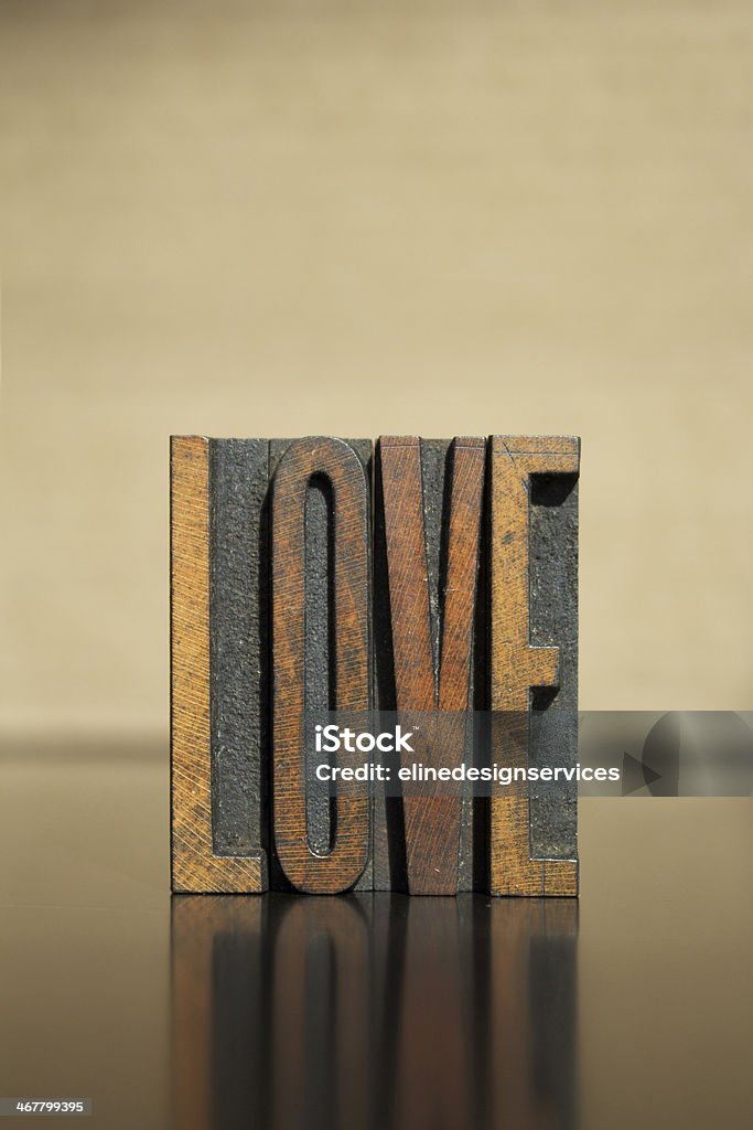 Love The word LOVE written in vintage letterpress type Aging Process Stock Photo
