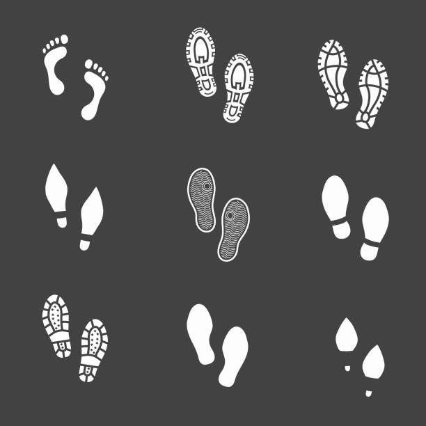 Set of footprints and shoeprints icons showing bare feet Set of footprints and shoeprints icons showing bare feet in white showing bare feet and the imprint of the soles with the differing patterns of male and female footwear with shoes boots and high heels high heel footprint stock illustrations