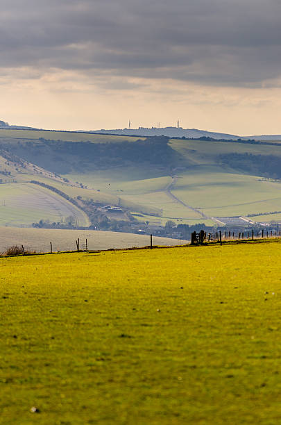 istock Towards Truleigh Hill with dappled sunlight and threatening sky 467801644