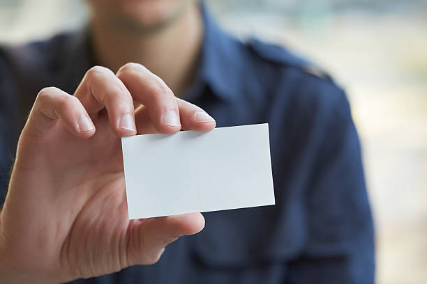 istock businessman giving a business card 467805640