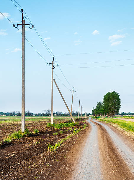 istock Rural road passing along the electric poles 467805814