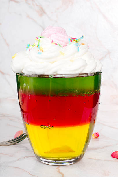 istock Colorful jelly with whipped cream and candy topping 467806168