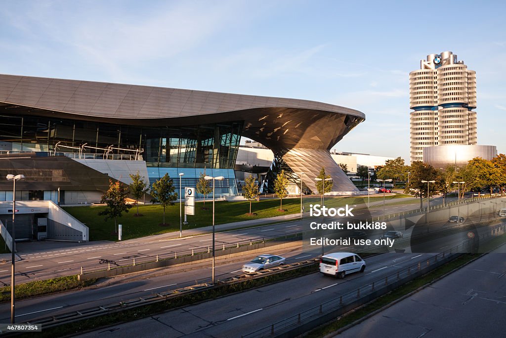 MUNICH: BMW Headquarter and museum at dusk Munich, Germany - October 2, 2012: BMW Headquarter and museum at dusk. The BMW Headquarter and Museum is located near the Olympiapark in Munich and was established in 1972 shortly before the Summer Olympics. 2015 Stock Photo