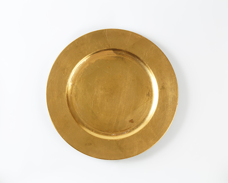 Round gold charger plate with wide rim