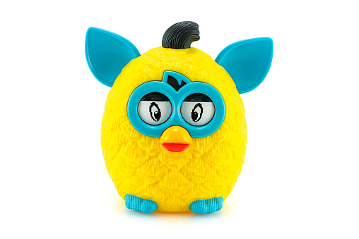 Bangkok, Thailand - March 21, 2014: Yellow furby from Furby Boom collection toy series. There are plastic toy sold as part of the McDonald's Happy meals.