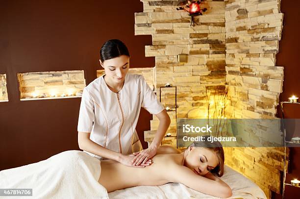 Beautiful Young Woman Getting Spa Massage Stock Photo - Download Image Now - 2015, Adult, Adults Only