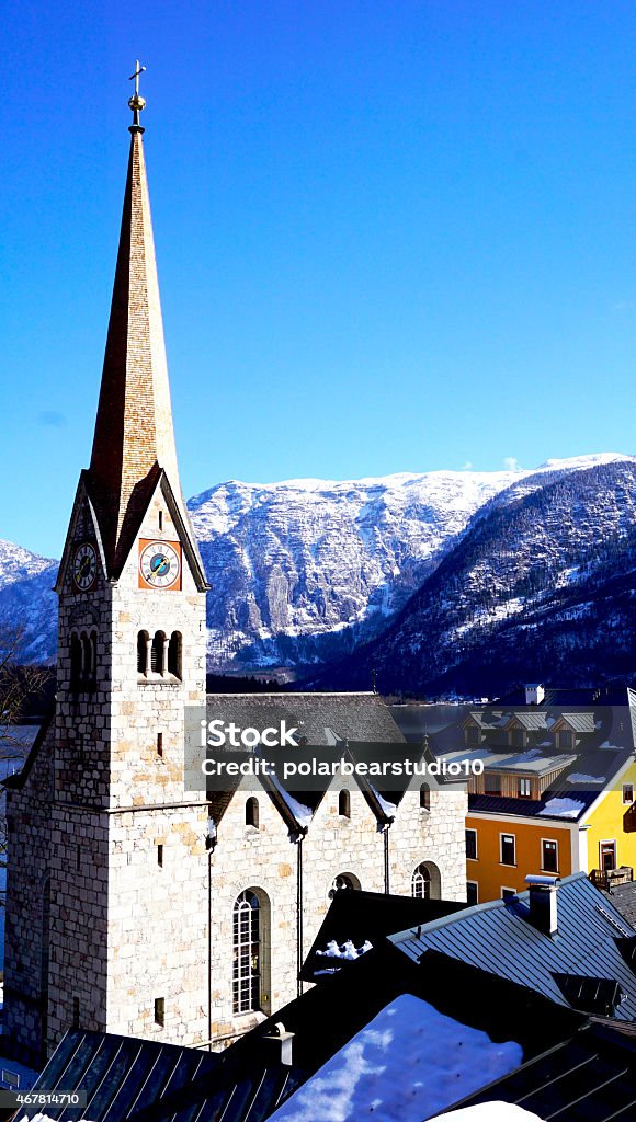 Hallstatt church with mountain view View of Bell tower of Hallstatt church, Hallstatt, Austria 2015 Stock Photo