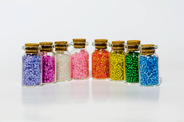 istock small glass jar's with arts and craft coloured beads 467815882