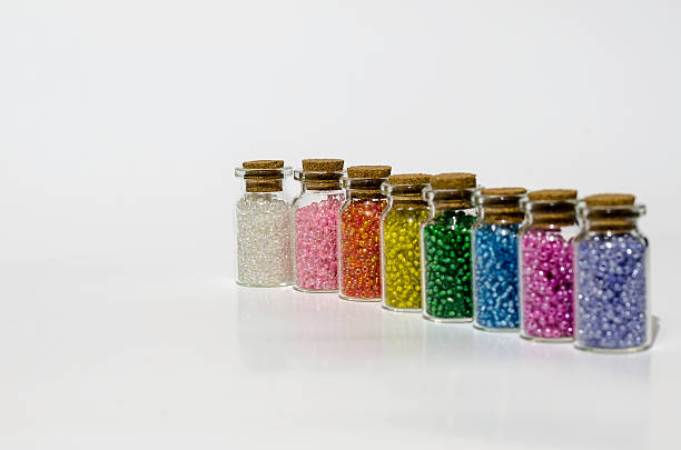 istock small glass jar's with arts and craft coloured beads 467815884
