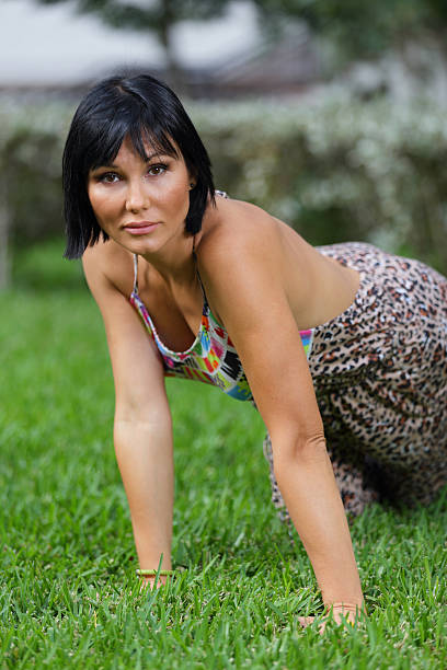 istock Woman crawling on the grass 467816664