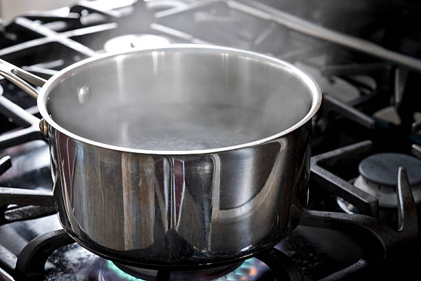 istock Water Boiling with Steam on a Gas Stove Top. 467817130