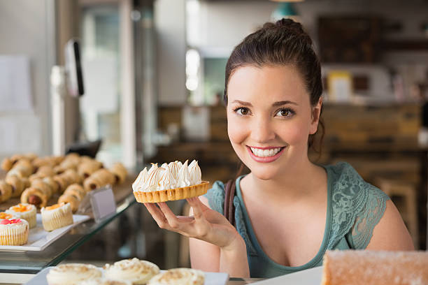 istock Pretty brunette holding lemon meringue pie 467817492