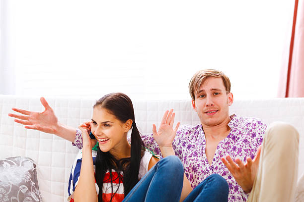 istock Man dissatisfied with long time talking on phone girlfriend. 467818704