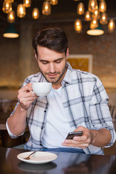 istock Young man having cup of coffee 467819398