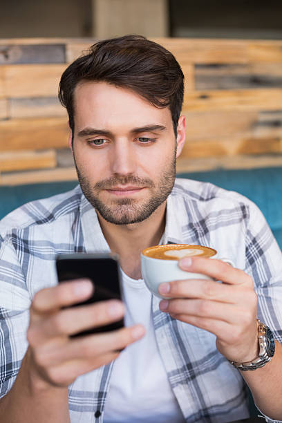 istock Young man having cup of coffee 467819602