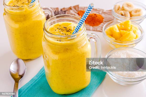 Pineapple Banana Coconut Turmeric And Chia Seed Smoothies Stock Photo - Download Image Now