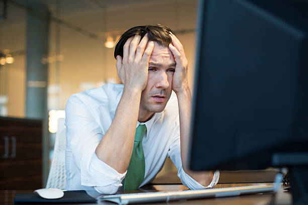 istock Businessman in trouble looking at computer 467820574