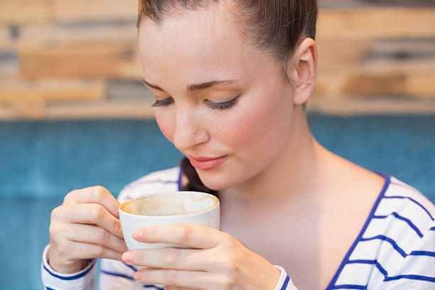istock Young woman having a cappuccino 467823394