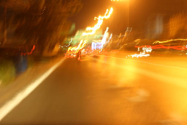 istock Blurred of car in city at night 467824518