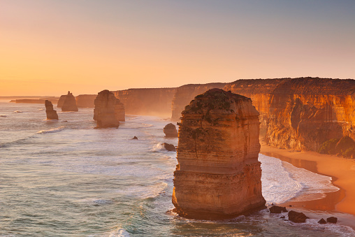 The Twelve Apostles in beautiful low sunlight along the Great Ocean Road, Victoria, Australia. Photographed at sunset.