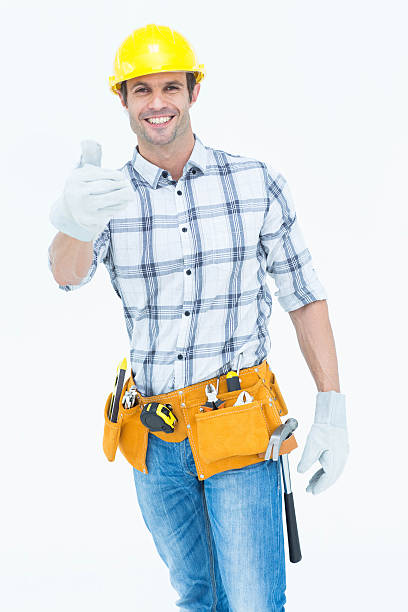 istock Male handyman gesturing thumbs up sign 467828896