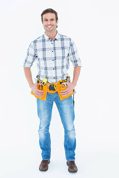 istock Repairman with tool belt around waist 467829364