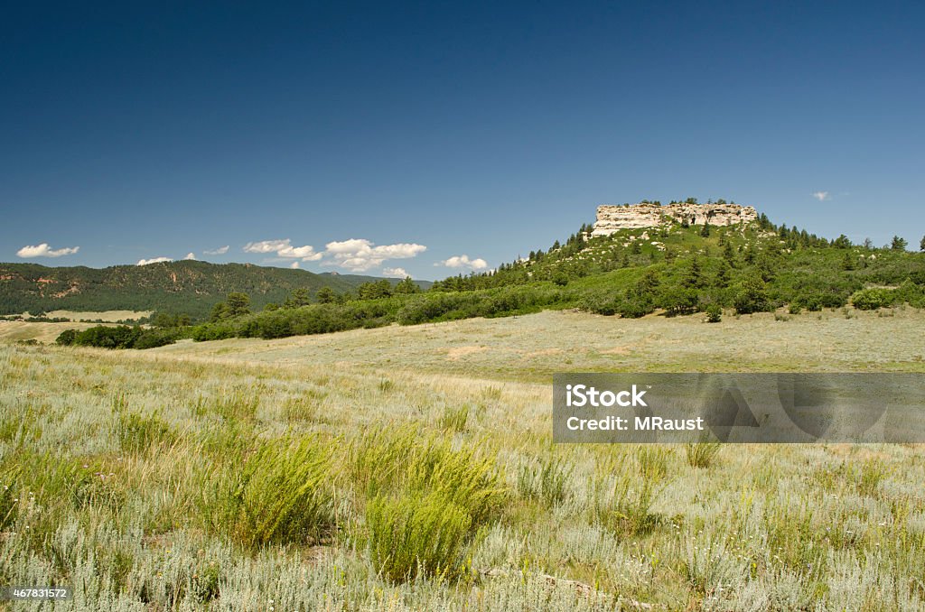 Short Grass Prairie of Rural Douglas County, Colorado The rolling hills and buttes in the short grass prairie of rural Douglas County, Colorado at the foot of the Rocky Mountains. Colorado Stock Photo