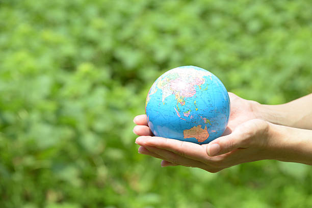 istock Globe in woman's hands, environmental protection concept 467833094