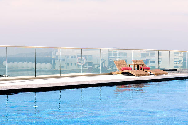 istock Relax Sun-beds near a swimming pool 467834337