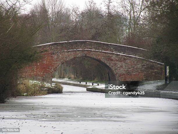 Brick Bridge Over A Frozen Canal Stock Photo - Download Image Now - 2015, Above, Brick