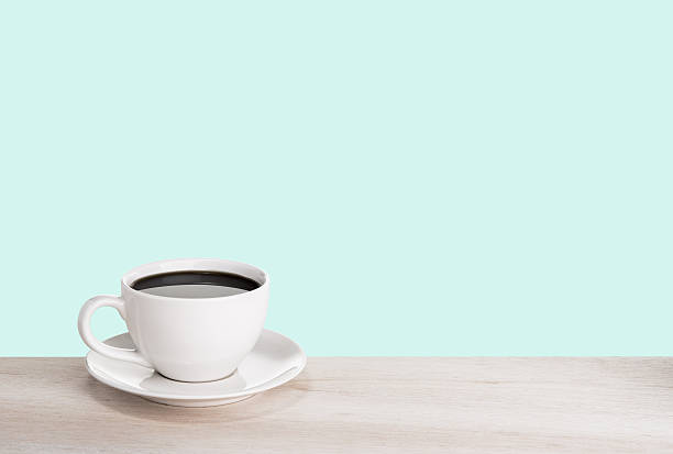 istock Cup of coffee on wooden table 467836912