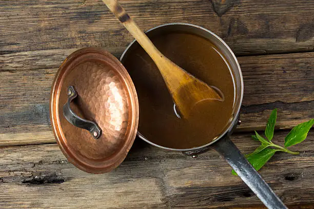 Gravy in a copper pot top view