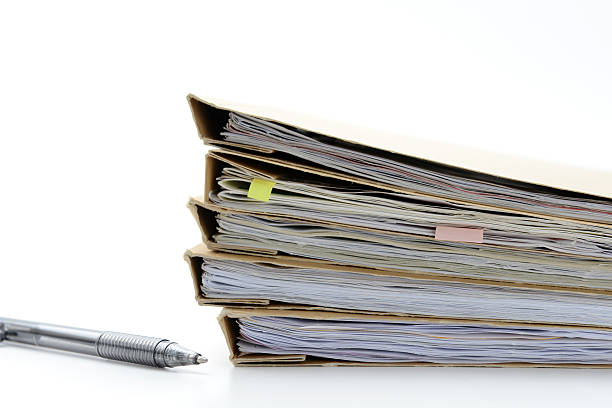 istock Piles of files and pen 467838636