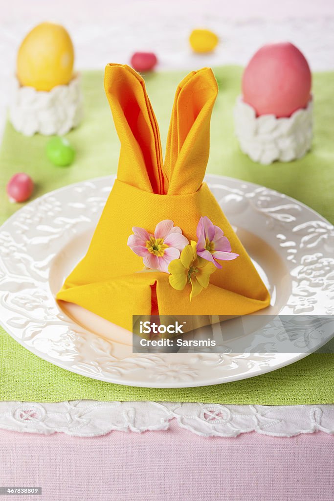 Easter table setting Festive table setting with Easter bunny napkin Beauty Stock Photo