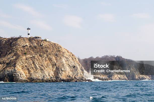 Bays Of Huatulco Lighthouse Punta Santa Cruz Stock Photo - Download Image Now - Huatulco, 2015, Bay of Water