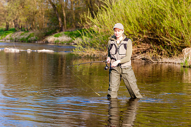 istock woman fishing 467846182