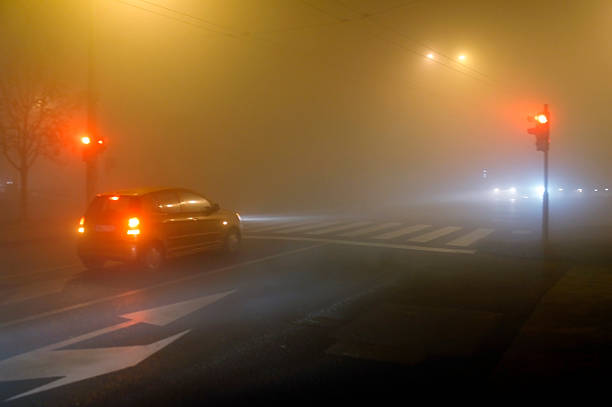 istock Stop lights in foggy night 467847903