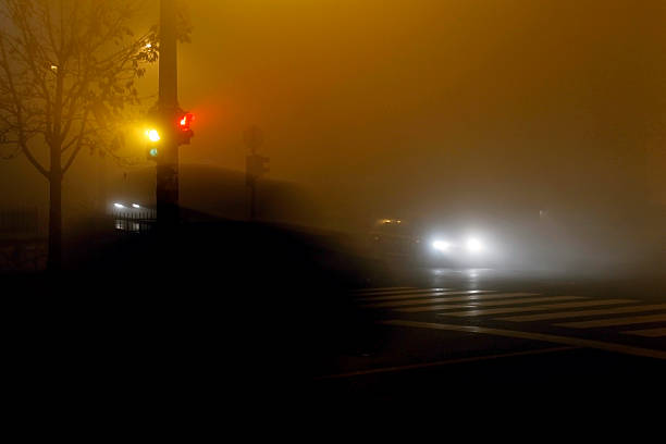 istock Trafic lights in foggy night 467847929
