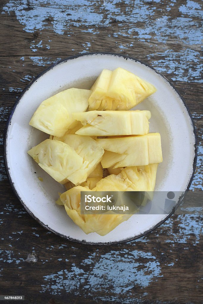 Slice of fresh on plate Slice of fresh pineapple on plate Block Shape Stock Photo