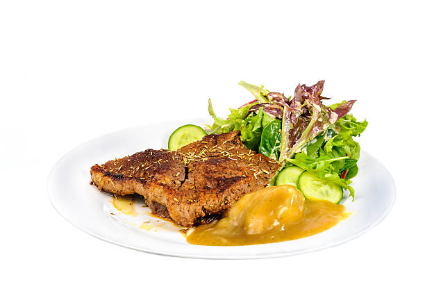 istock Rump steak with mashed potatoes and mix vegetable on plate 467848540