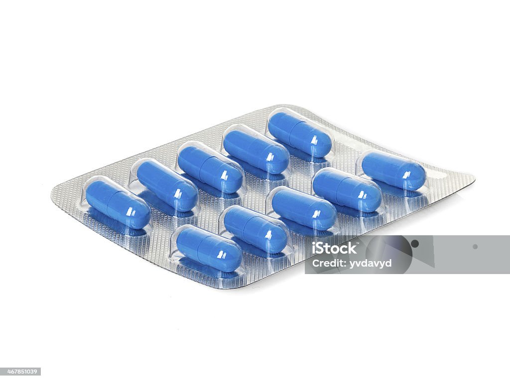 Blue medication capsules in blister pack close-up Antibiotic Stock Photo