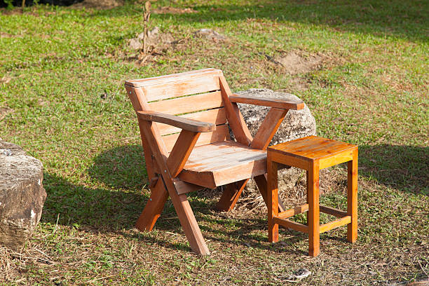 istock Wooden chairs placed on the lawn. 467851329