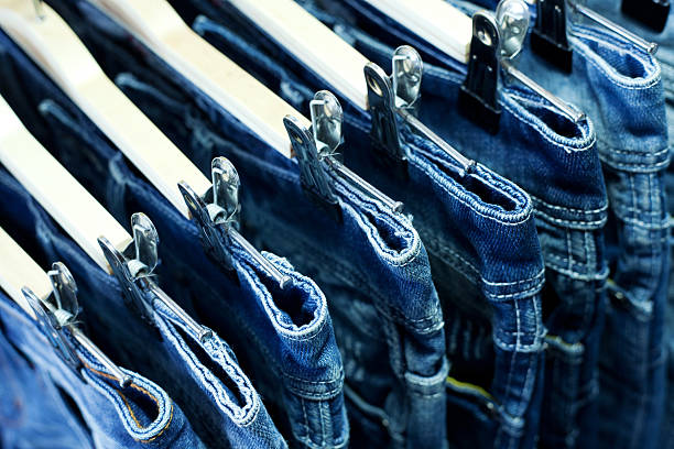 istock Row of hanged blue jeans 467852317